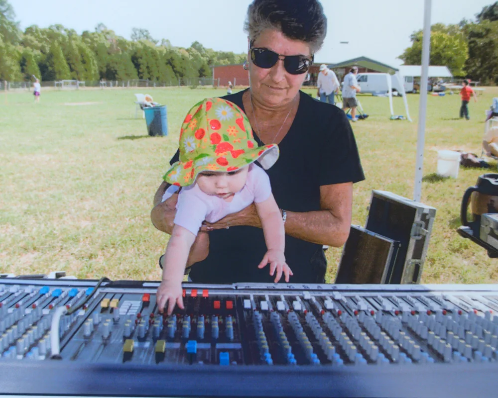 Outdoor live-sound session at a mixing console
