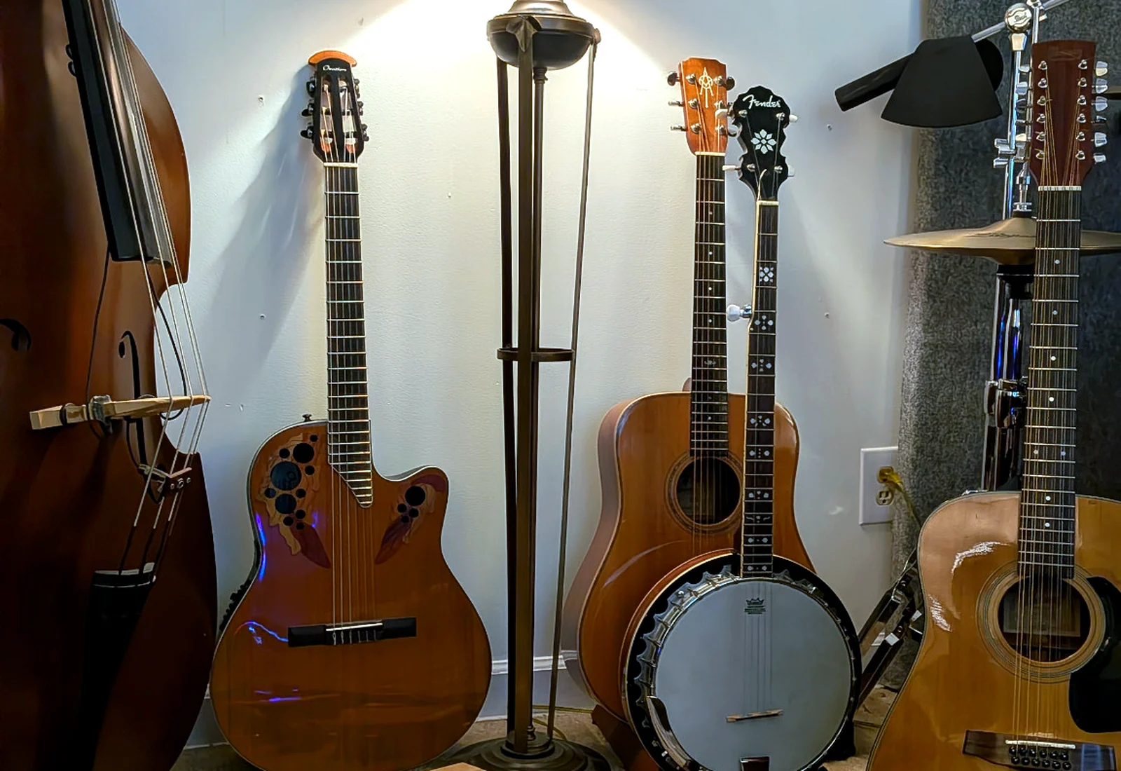 Collection of string instruments and studio gear in Sunset Studios